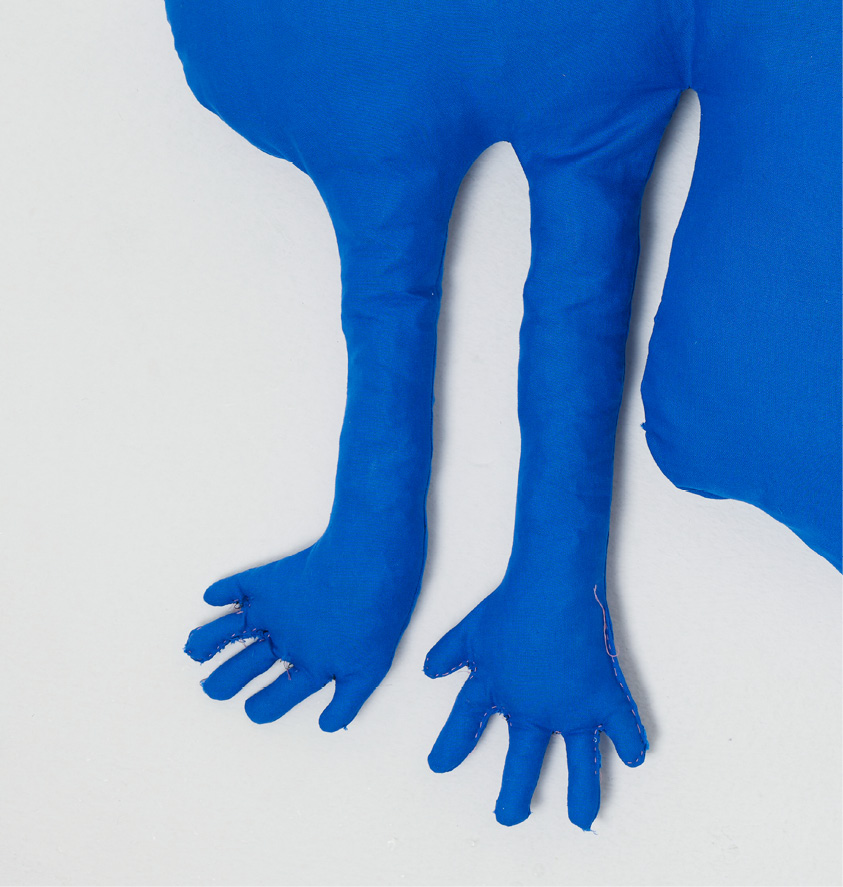 Detail of the blue textile legs and hands